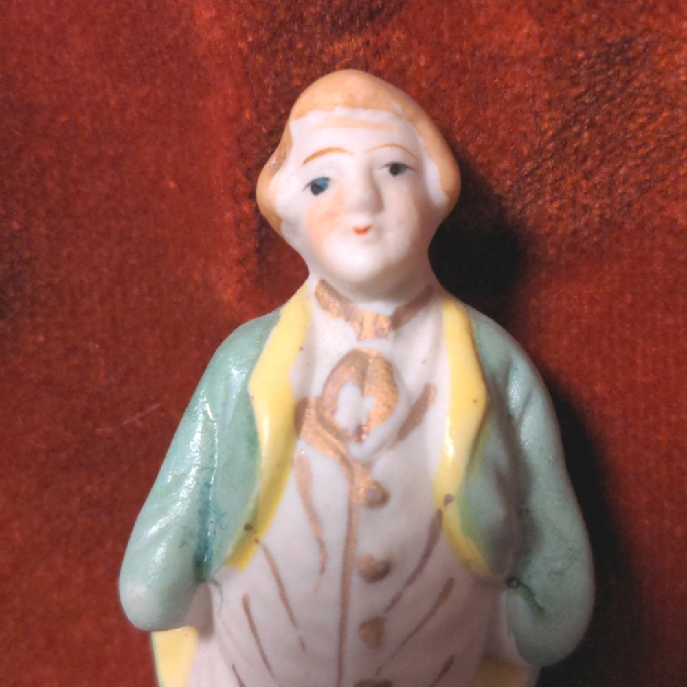 Disappointed Founding Father, small figurine and pocket constitution.